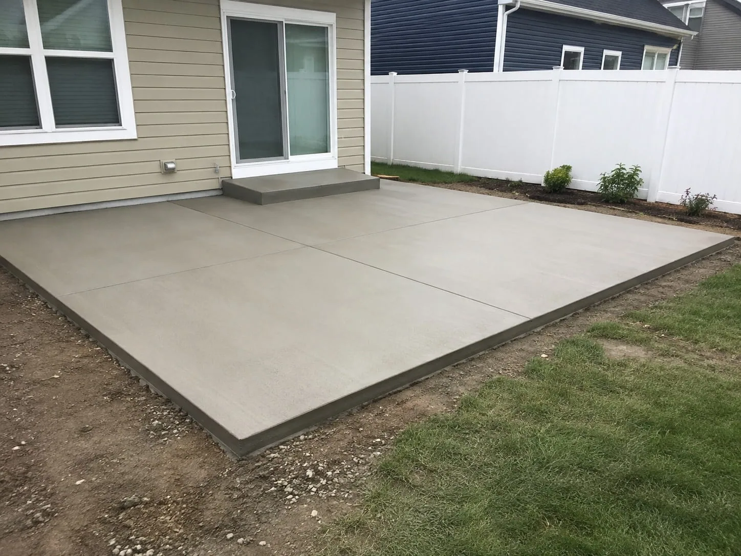 Freshly poured concrete slab set out behind a Toowoomba home with its edges still standing clear of the ground